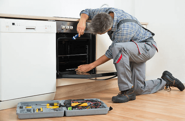 broken dishwasher in a home